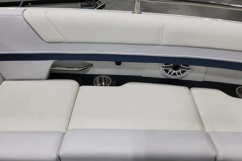 Slide: The Image of 2026 Formula 330 Crossover Bowrider OB interior seating with cup holders and speaker. - 33
