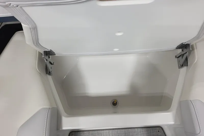 Slide: The Image of Open storage compartment in 2026 Formula 330 Crossover Bowrider OB boat. - 35