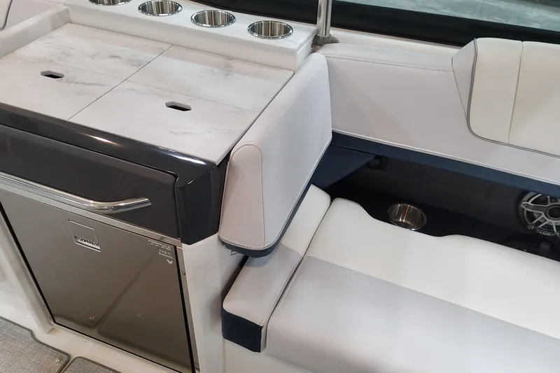 Slide: The Image of 2026 Formula 330 Crossover Bowrider OB interior with seating and built-in cup holders. - 47