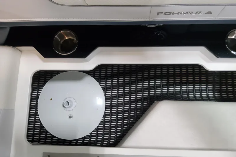 Slide: The Image of 2026 Formula 330 Crossover Bowrider OB interior detail with cup holders and textured flooring. - 49