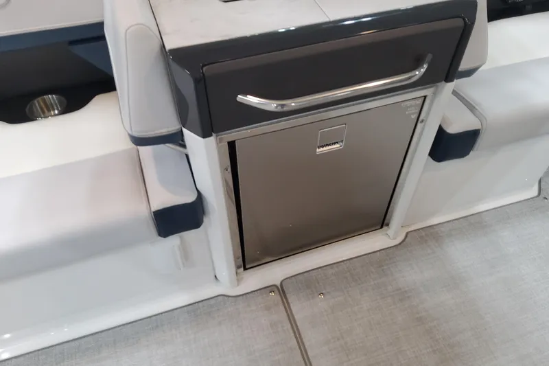 Slide: The Image of 2026 Formula 330 Crossover Bowrider OB interior with built-in stainless steel refrigerator. - 50