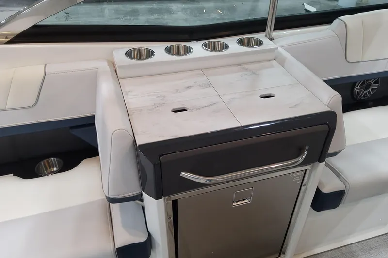 Slide: The Image of 2026 Formula 330 Crossover Bowrider OB interior with cup holders and sleek design. - 51