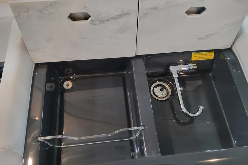 Slide: The Image of Dual sink with modern faucet on 2026 Formula 330 Crossover Bowrider OB boat. - 52