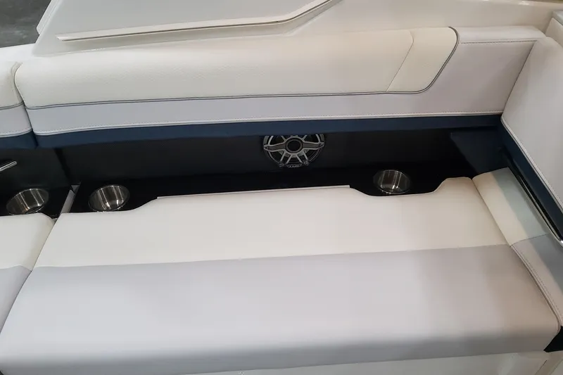 Slide: The Image of 2026 Formula 330 Crossover Bowrider OB interior seating with cup holders and speaker. - 57