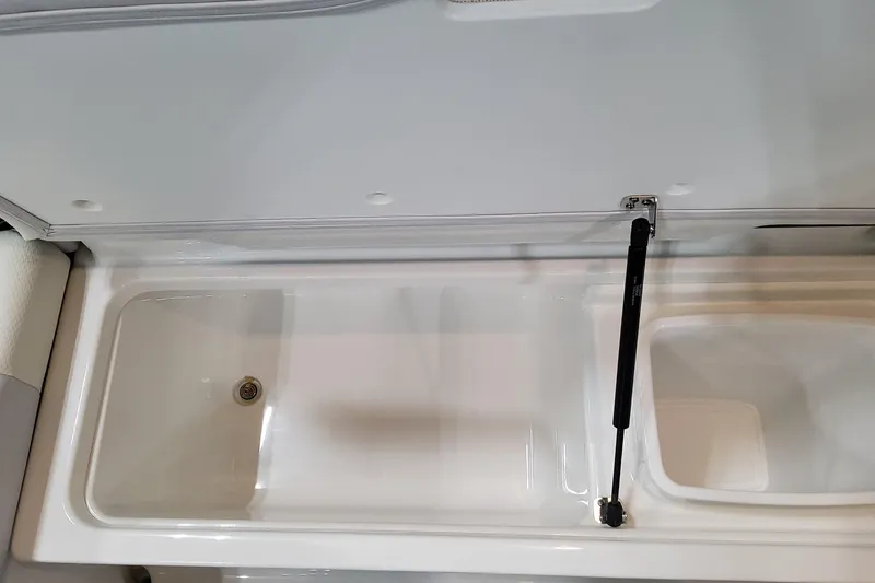 Slide: The Image of 2026 Formula 330 Crossover Bowrider OB storage compartment with hydraulic lift. - 60