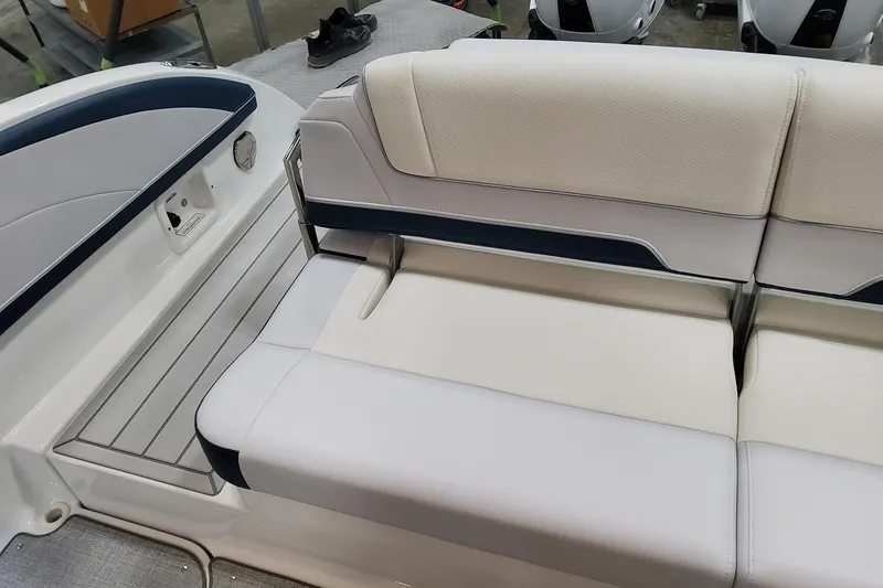 Slide: The Image of 2026 Formula 330 Crossover Bowrider OB interior seating with white and navy upholstery. - 62
