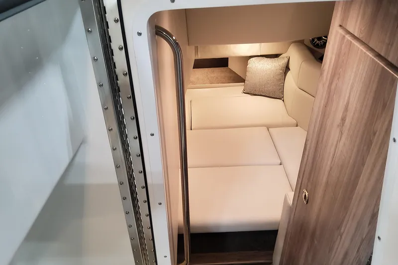Slide: The Image of Interior cabin of 2026 Formula 330 Crossover Bowrider OB, featuring cozy seating and modern design. - 71
