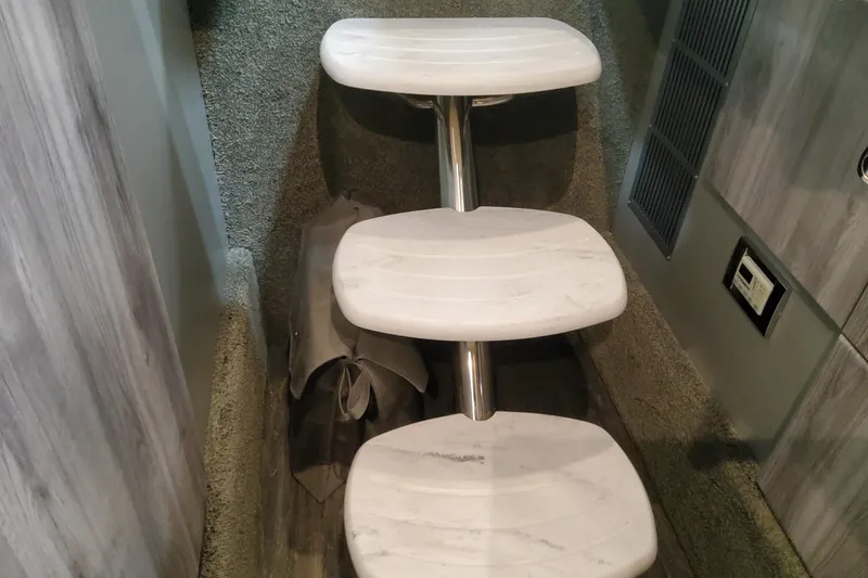 Slide: The Image of Interior steps of 2026 Formula 330 Crossover Bowrider OB, featuring modern design and carpeting. - 72