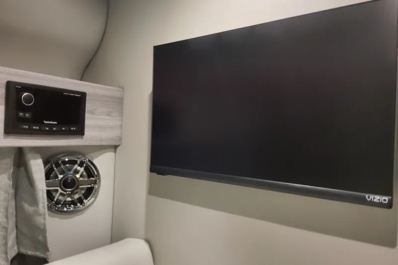 Slide: The Image of Interior of 2026 Formula 330 Crossover Bowrider OB with Vizio TV and sound system. - 77