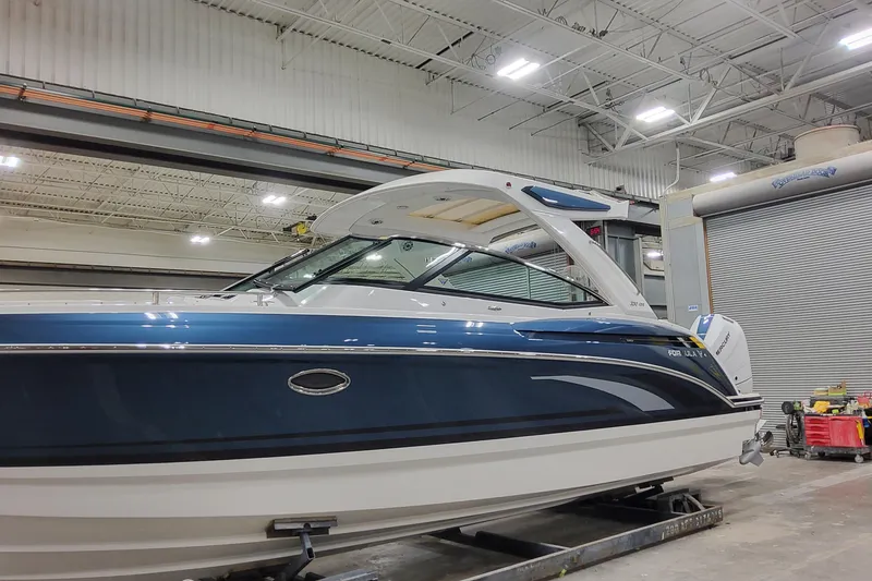 Slide: The Image of 2026 Formula 330 Crossover Bowrider OB in a showroom, showcasing sleek design and modern features. - 8