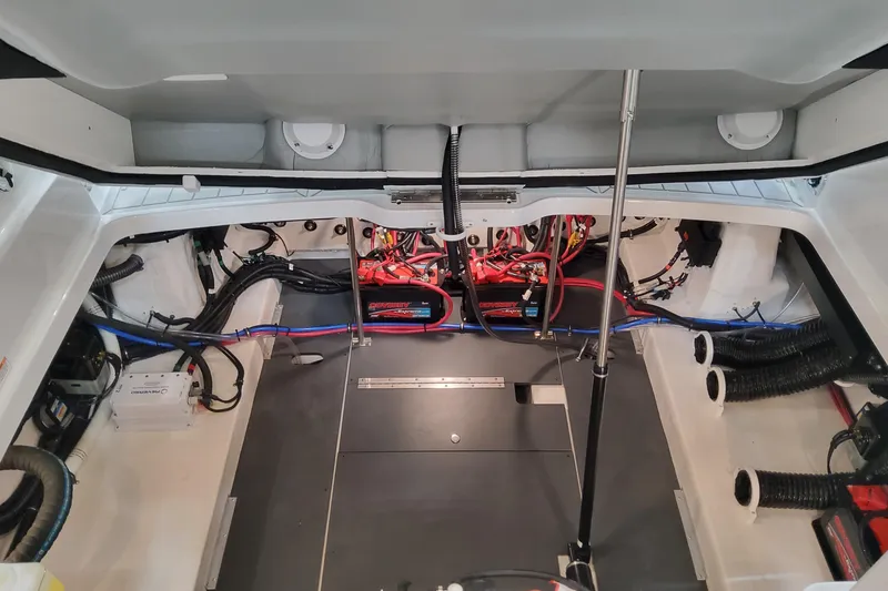 Slide: The Image of Engine compartment of 2026 Formula 330 Crossover Bowrider OB, showcasing wiring and components. - 87