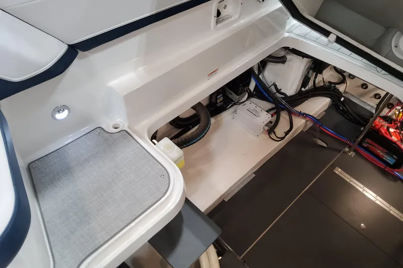 Slide: The Image of 2026 Formula 330 Crossover Bowrider OB interior showing storage and wiring details. - 88
