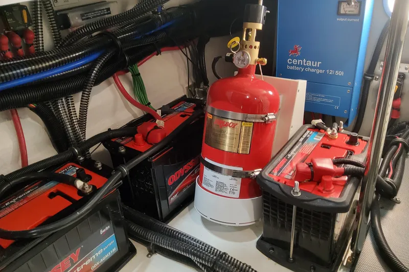 Slide: The Image of Electrical system of 2026 Formula 330 Crossover Bowrider OB with batteries and fire extinguisher. - 90