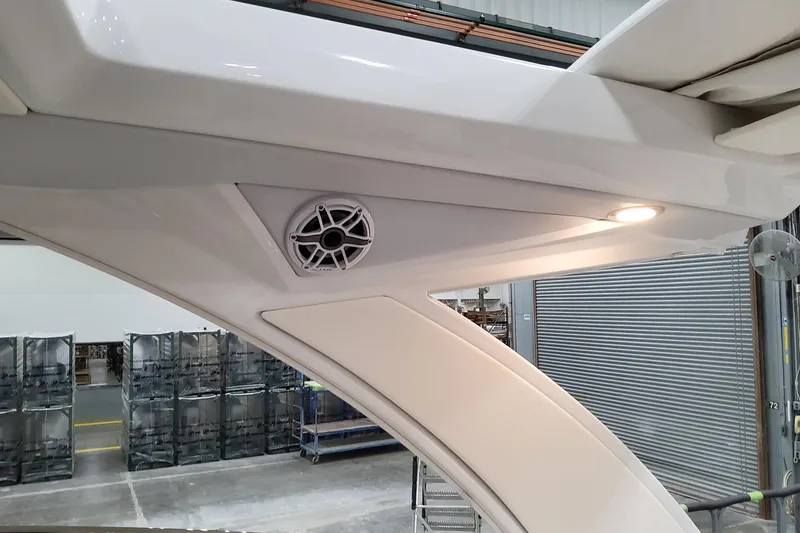 Slide: The Image of 2026 Formula 330 Crossover Bowrider OB interior detail with speaker and lighting. - 92