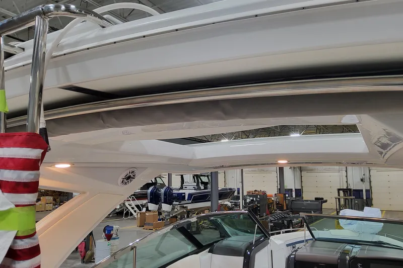 Slide: The Image of 2026 Formula 330 Crossover Bowrider OB interior view in a showroom setting. - 93