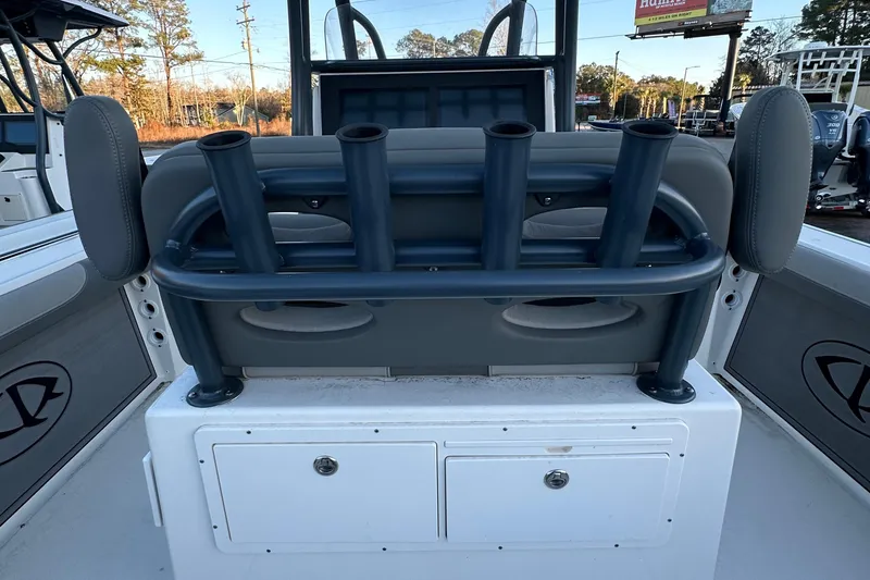 Slide: The Image of 2024 Sea Born LX 26 LE boat with rod holders and storage compartments. - 11