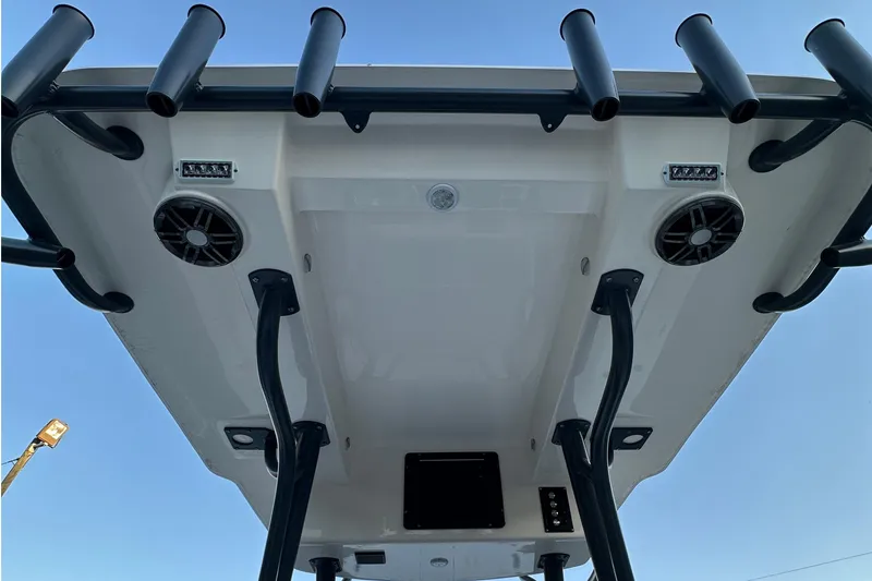 Slide: The Image of 2024 Sea Born LX 26 LE boat roof with rod holders and speakers, viewed from below. - 12