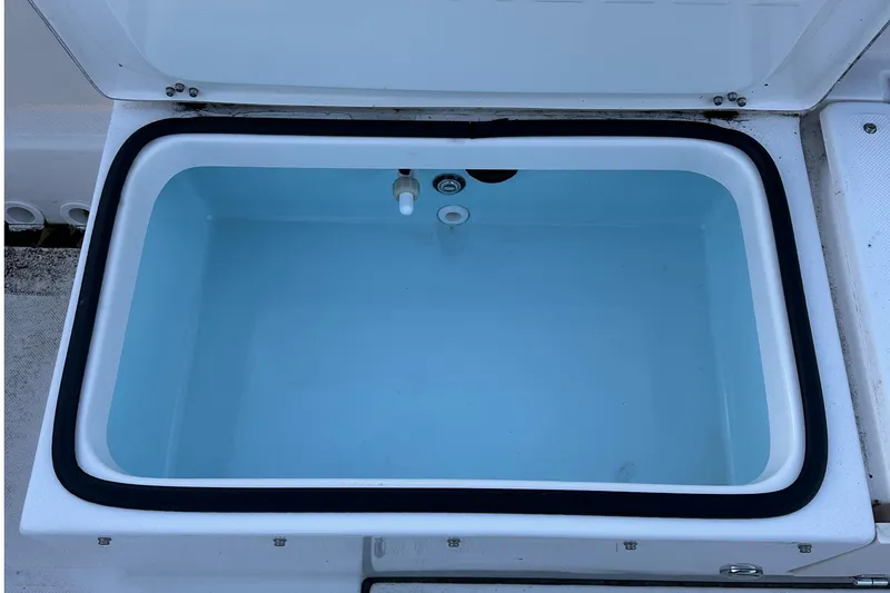 Slide: The Image of 2024 Sea Born LX 26 LE livewell, open lid, showing interior details. - 7