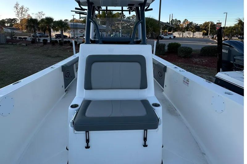 Slide: The Image of 2024 Sea Born LX 26 LE boat interior with seating and console view. - 8