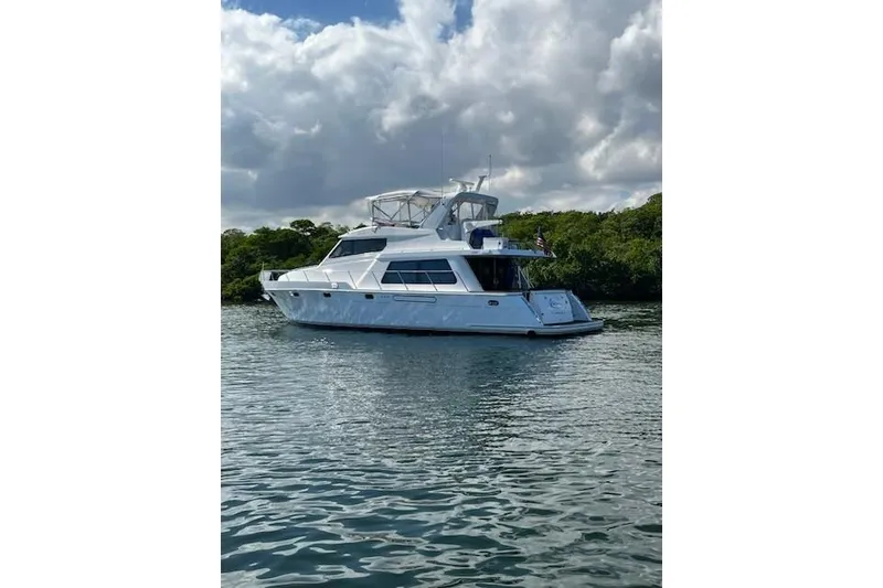 Slide: The Image of 2007 Pama 540 LX Pilothouse yacht on calm water under cloudy sky. - 10