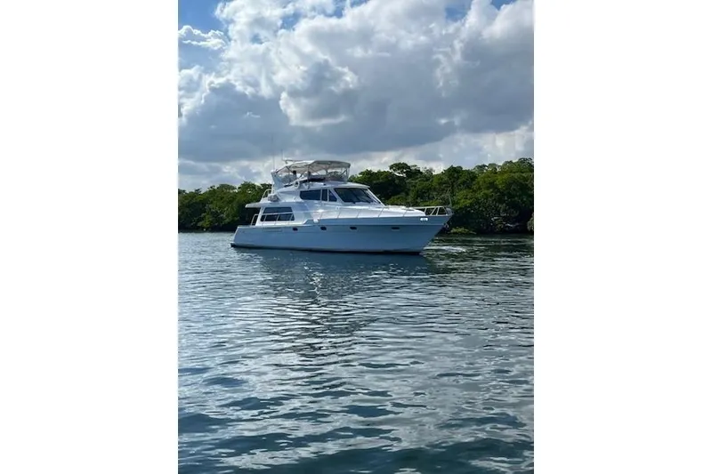 Slide: The Image of 2007 Pama 540 LX Pilothouse yacht on calm water under cloudy sky. - 11