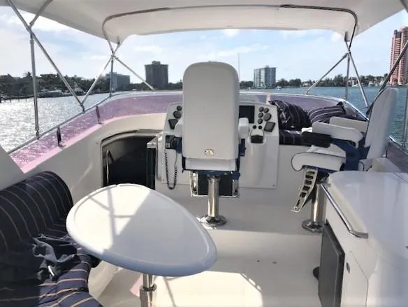 Slide: The Image of Pilothouse of 2007 Pama 540 LX yacht with seating and control panel, overlooking waterfront. - 15