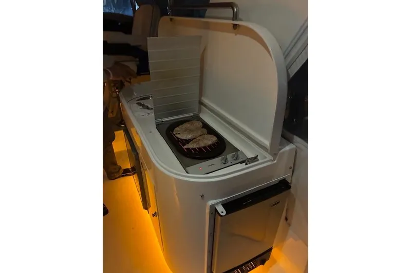 Slide: The Image of Outdoor grill setup on 2007 Pama 540 LX Pilothouse yacht with illuminated flooring. - 17