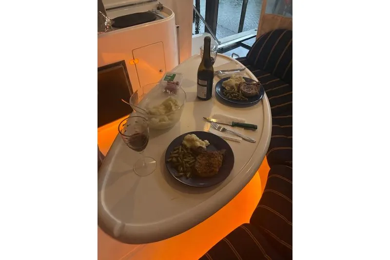 Slide: The Image of Dinner setup on 2007 Pama 540 LX Pilothouse yacht with wine and plates. - 18