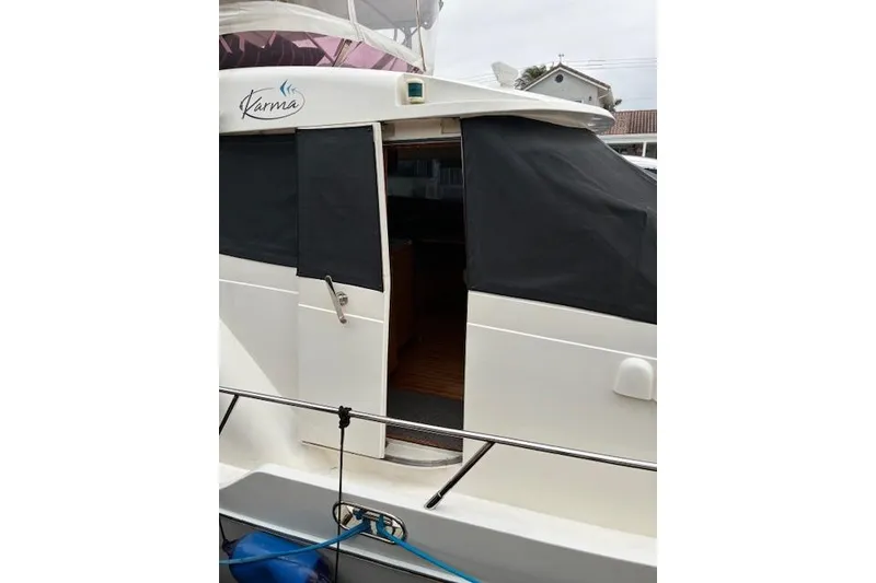 Slide: The Image of 2007 Pama 540 LX Pilothouse yacht with covered entrance and visible deck area. - 22