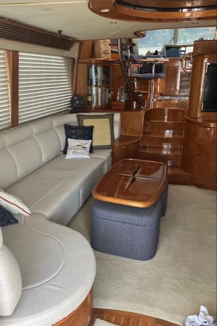 Slide: The Image of Luxurious interior of a 2007 Pama 540 LX Pilothouse yacht with elegant wood finishes. - 29