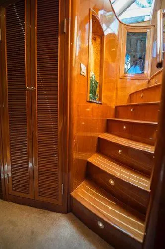 Slide: The Image of Interior of 2007 Pama 540 LX Pilothouse with polished wooden stairs and closet. - 31