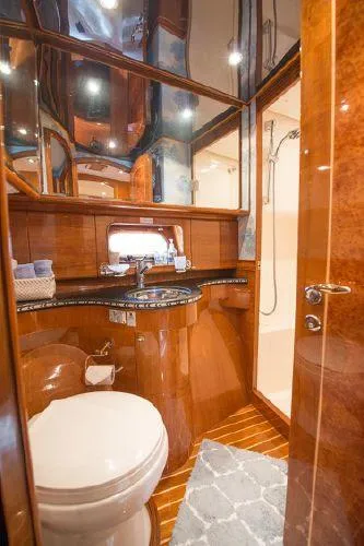 Slide: The Image of Luxurious bathroom in 2007 Pama 540 LX Pilothouse yacht with wood accents and modern fixtures. - 36