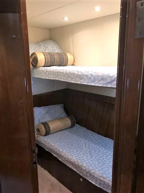 Slide: The Image of Bunk beds in 2007 Pama 540 LX Pilothouse cabin with decorative pillows. - 37