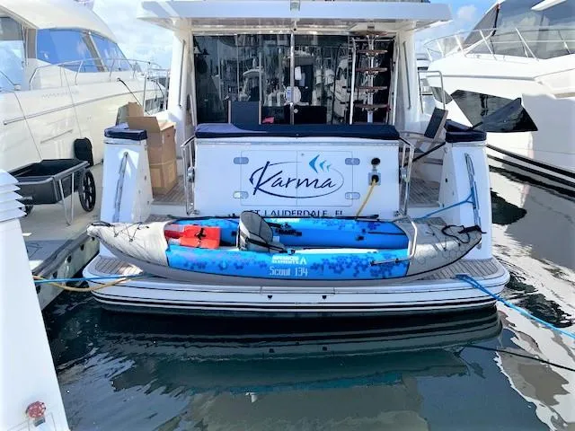 Slide: The Image of 2007 Pama 540 LX Pilothouse yacht docked with kayak on swim platform. - 7