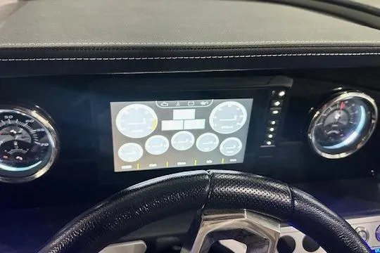 Slide: The Image of Dashboard of 2024 Crownline 240 SS boat with digital display and gauges. - 11