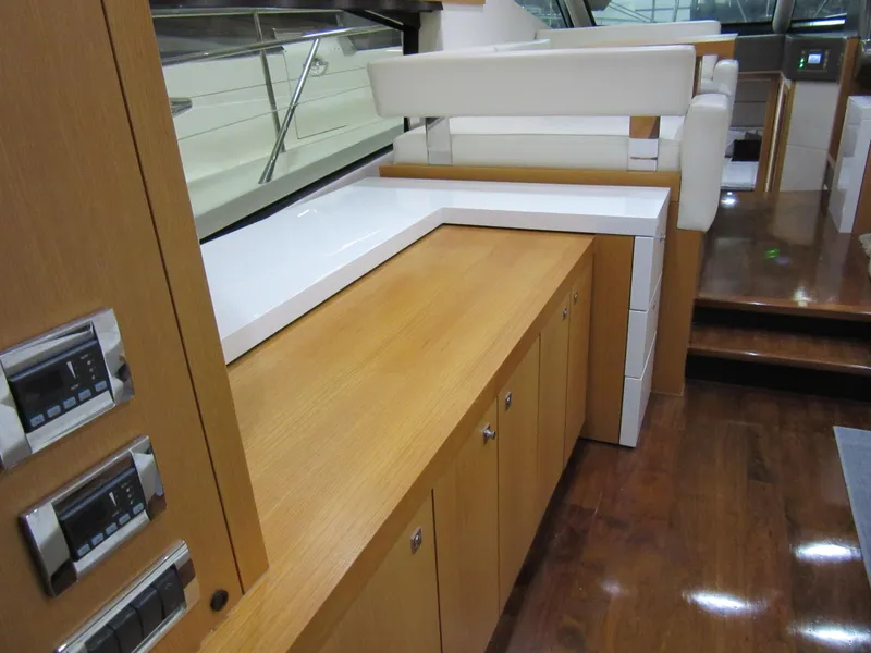 Slide: The Image of Luxurious interior of 2014 Sunseeker Manhattan 53 yacht with sleek wood cabinetry. - 13