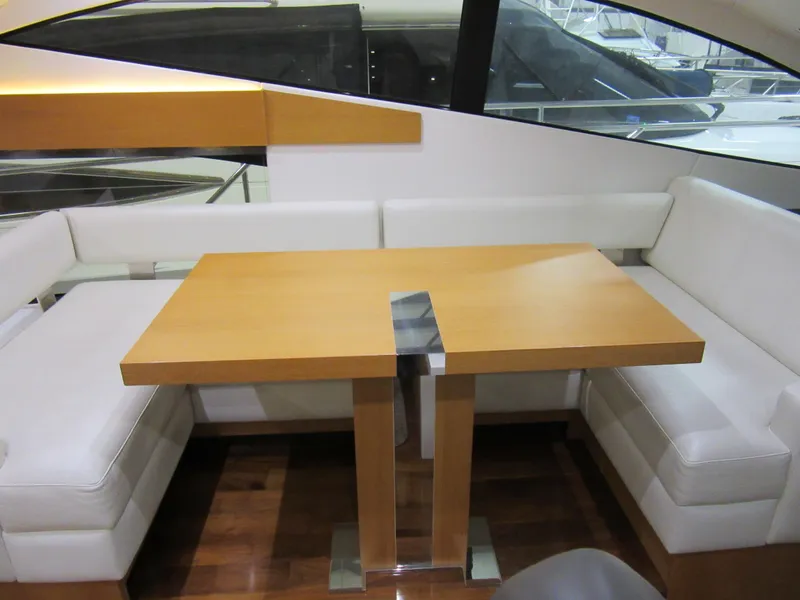 Slide: The Image of Luxurious interior of 2014 Sunseeker Manhattan 53 yacht with elegant seating and wooden table. - 15