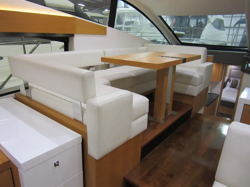 Slide: The Image of Luxurious interior of 2014 Sunseeker Manhattan 53 yacht with elegant seating and wooden table. - 16