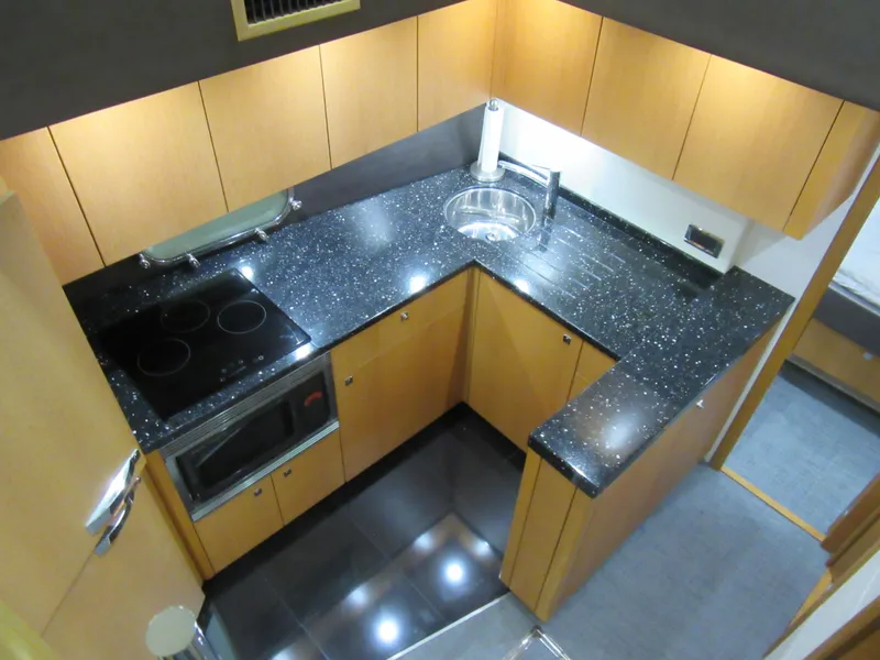 Slide: The Image of Modern kitchen in 2014 Sunseeker Manhattan 53 yacht with sleek countertops and appliances. - 18