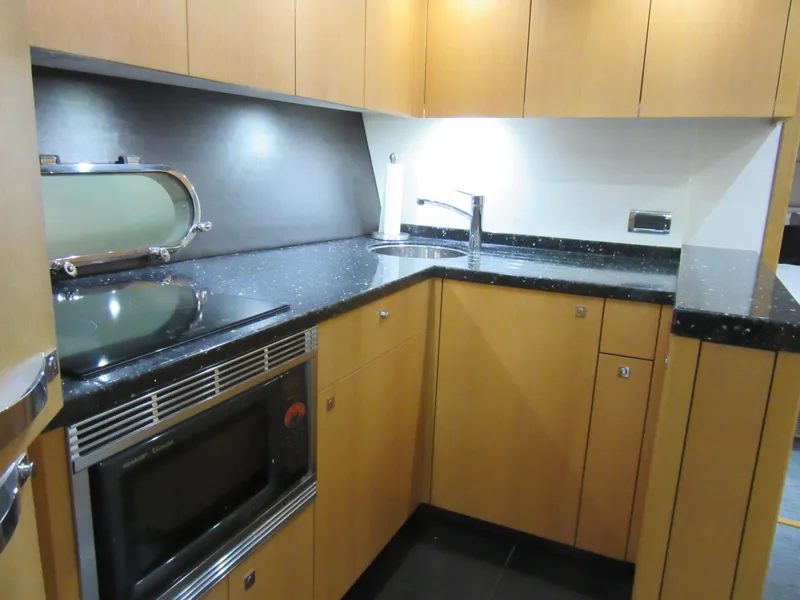 Slide: The Image of Modern kitchen in 2014 Sunseeker Manhattan 53 yacht with sleek cabinetry and appliances. - 20