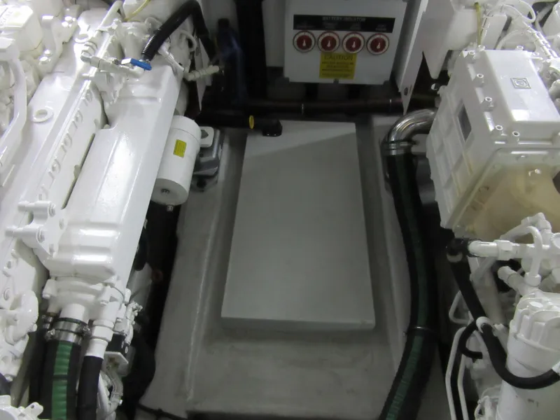 Slide: The Image of Engine room of a 2014 Sunseeker Manhattan 53 yacht, showcasing mechanical components. - 26