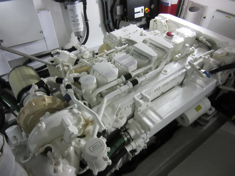 Slide: The Image of Engine room of 2014 Sunseeker Manhattan 53 yacht, showcasing detailed machinery components. - 27
