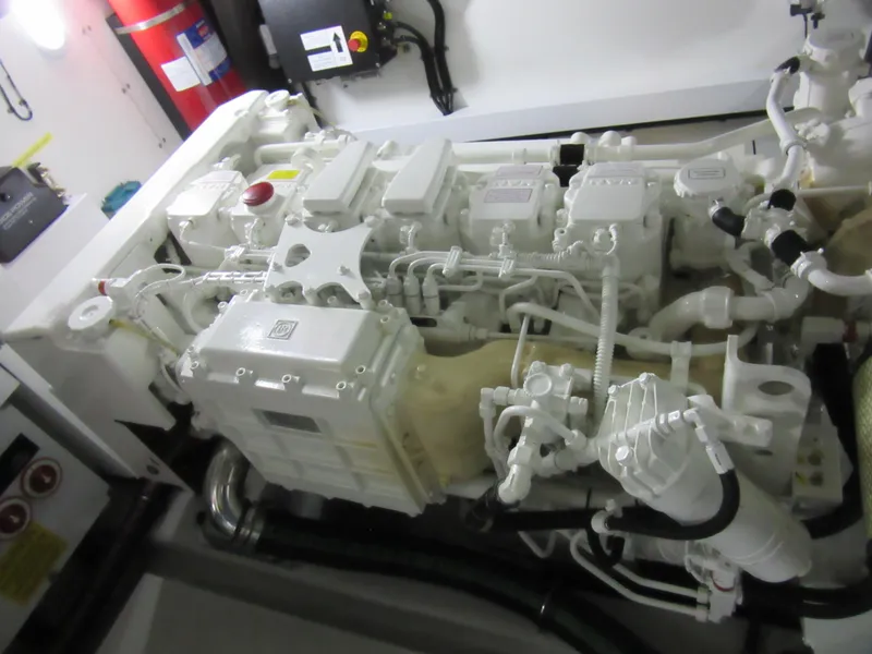 Slide: The Image of Engine room of a 2014 Sunseeker Manhattan 53 yacht, showcasing detailed machinery. - 28