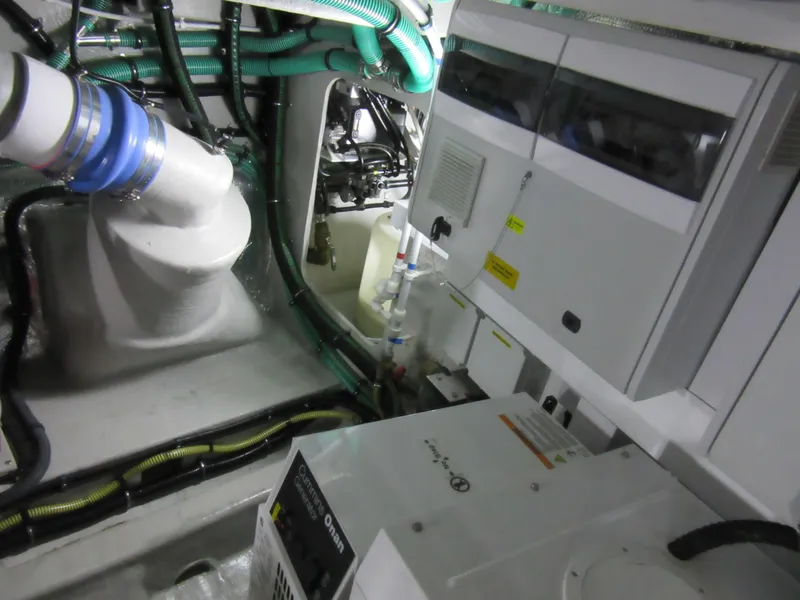 Slide: The Image of Engine room of 2014 Sunseeker Manhattan 53 yacht with visible machinery and wiring. - 30