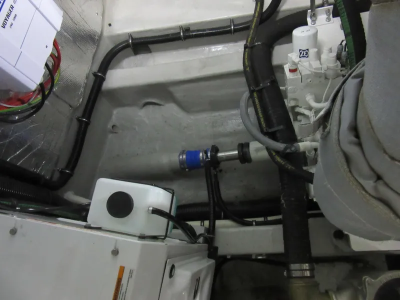 Slide: The Image of Engine room of 2014 Sunseeker Manhattan 53 yacht, showcasing mechanical components and wiring. - 31