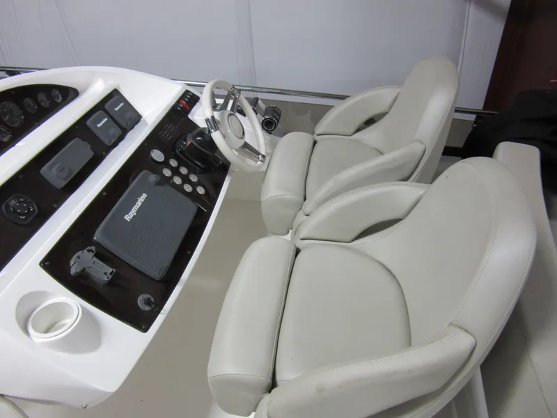 Slide: The Image of Helm of 2014 Sunseeker Manhattan 53 yacht with dual seats and control panel. - 6