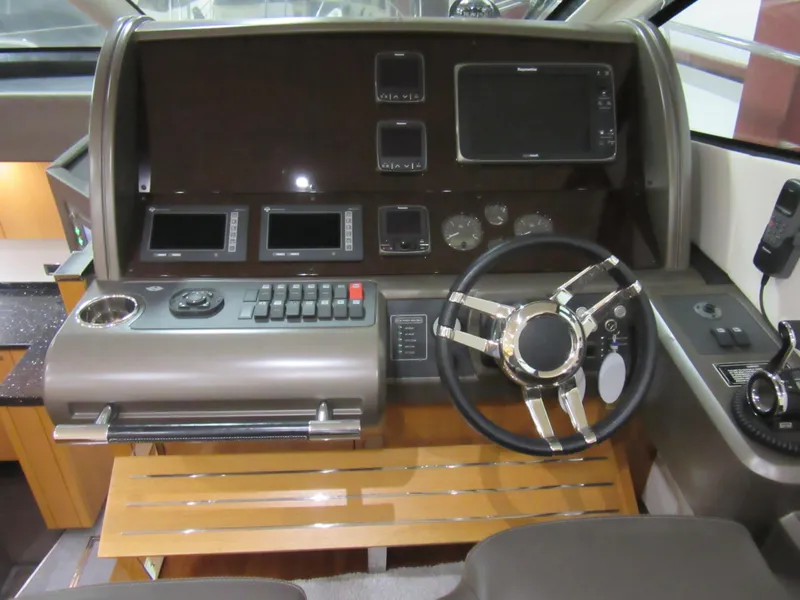 Slide: The Image of Control panel of 2014 Sunseeker Manhattan 53 yacht with steering wheel and navigation instruments. - 8