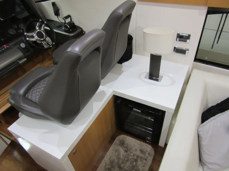 Slide: The Image of Interior of 2014 Sunseeker Manhattan 53 yacht with helm seats and modern decor. - 9