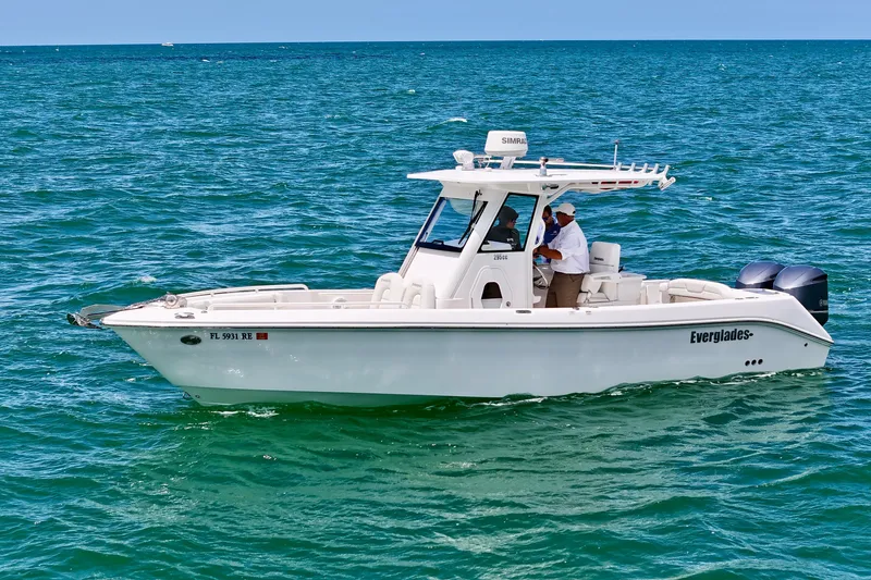The Image of 2015 Everglades 295 Center Console boat cruising on open water. - 1