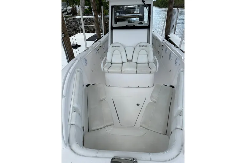 Slide: The Image of 2015 Everglades 295 Center Console boat interior with white seating and console. - 19
